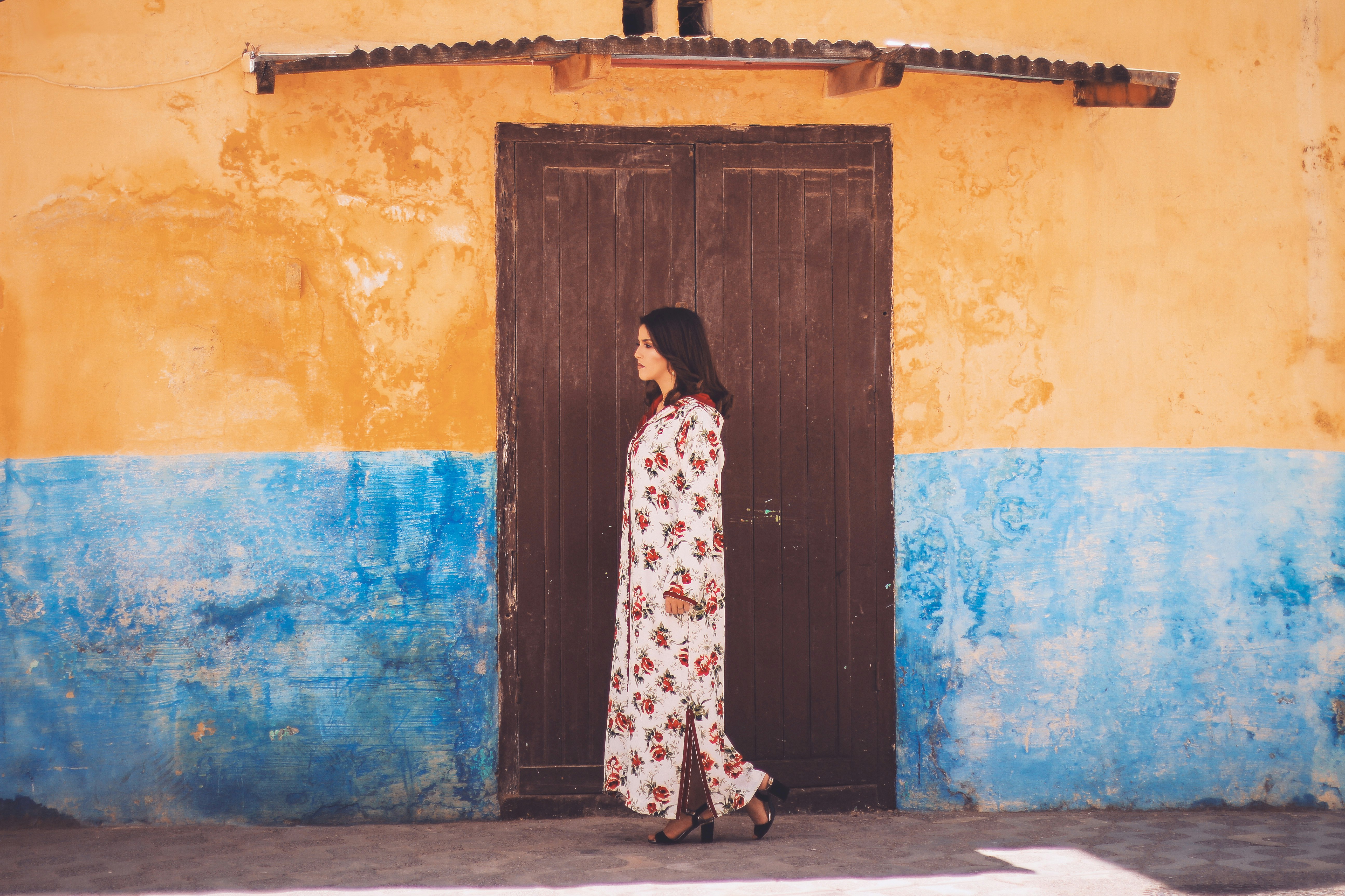 woman standing near wooden door